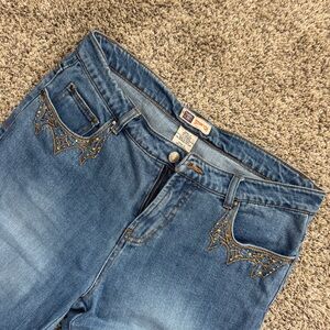 Faded glory blue bootcut jeans with rhinestone details. Size 10